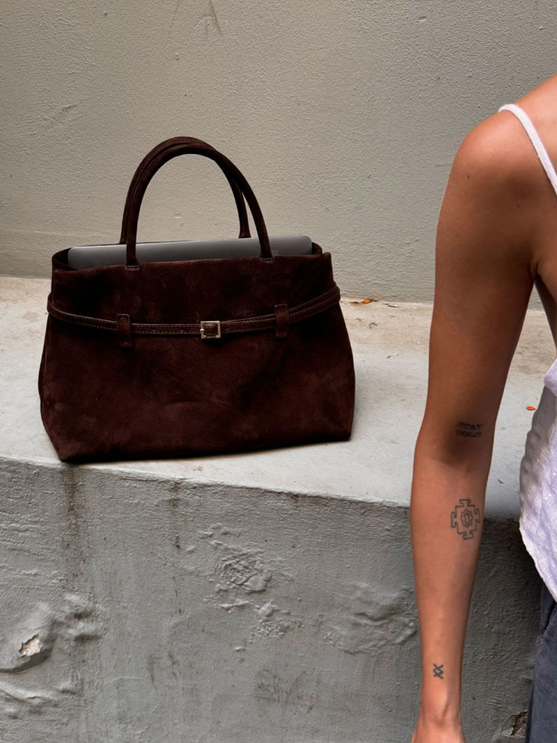 Women’s satchel bag in suede-look material with strap closure and short handle