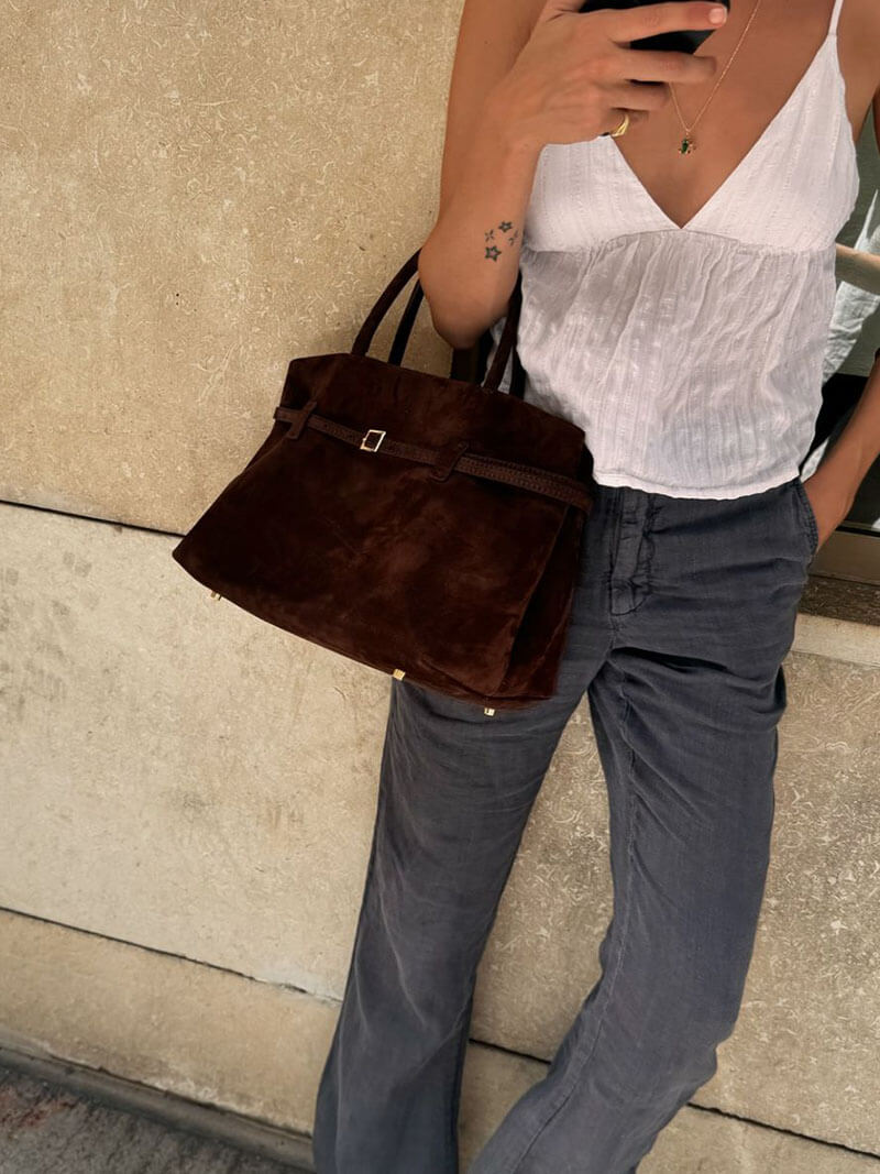 Women’s satchel bag in suede-look material with strap closure and short handle