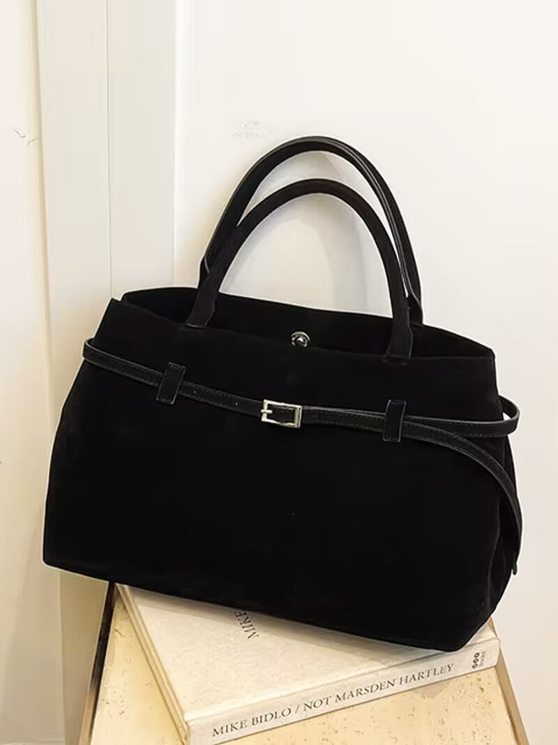 Women’s satchel bag in suede-look material with strap closure and short handle