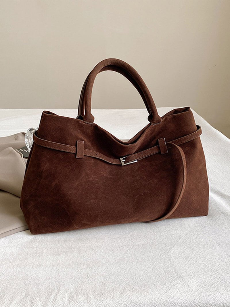 Women’s satchel bag in suede-look material with strap closure and short handle