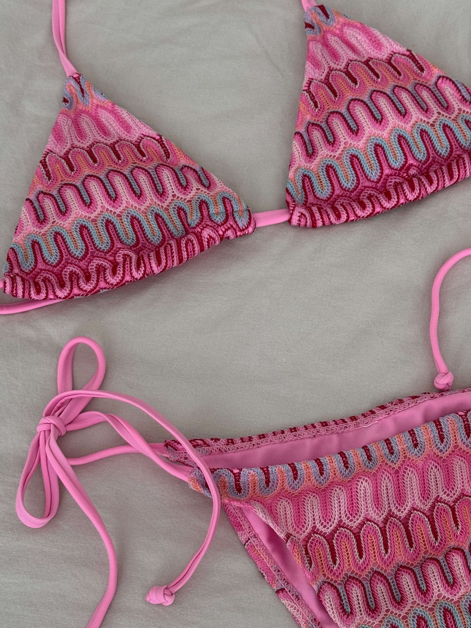 Women’s 3-piece bikini set with triangle top, tie-side bottoms, and mini skirt