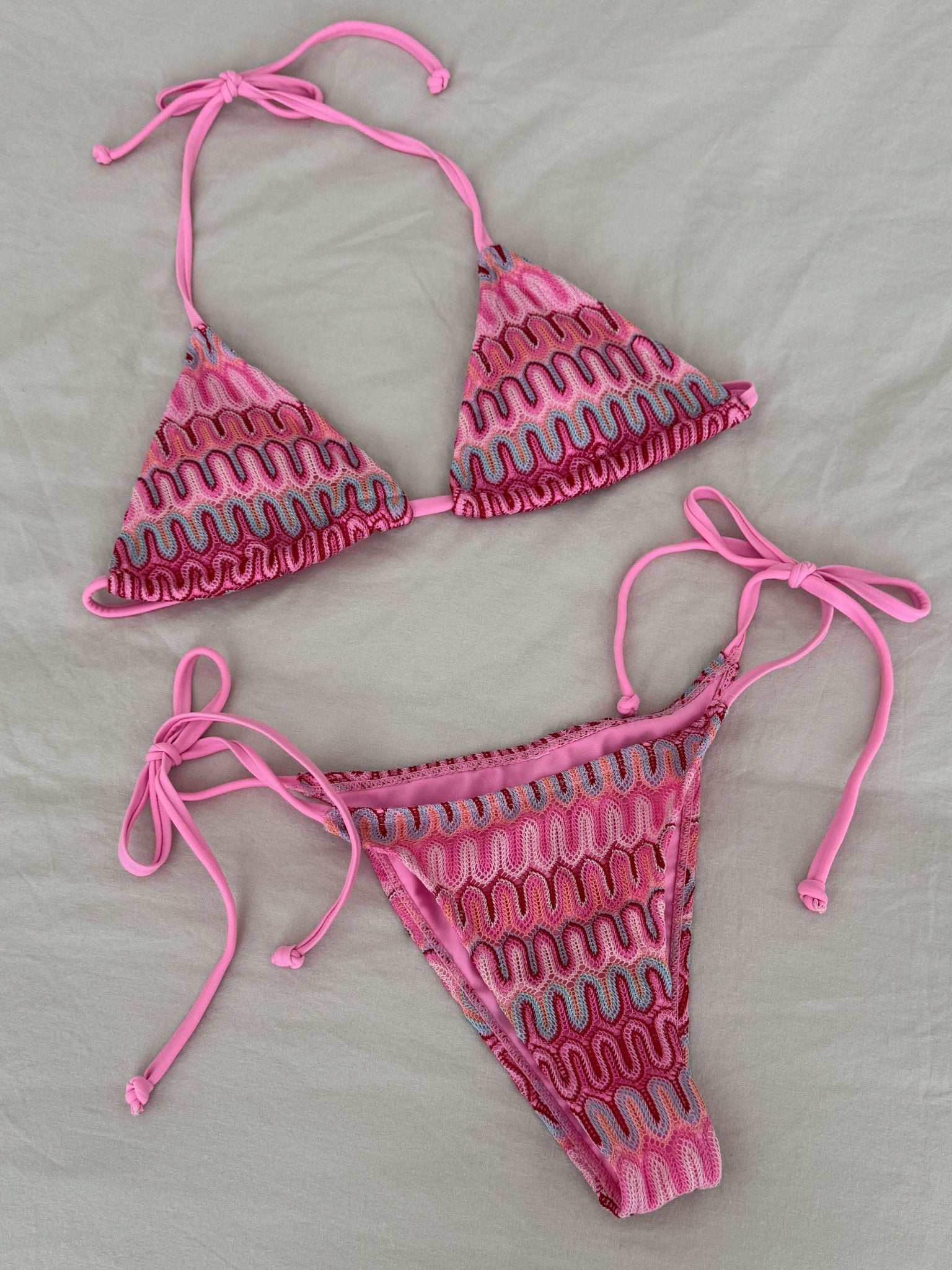 Women’s 3-piece bikini set with triangle top, tie-side bottoms, and mini skirt