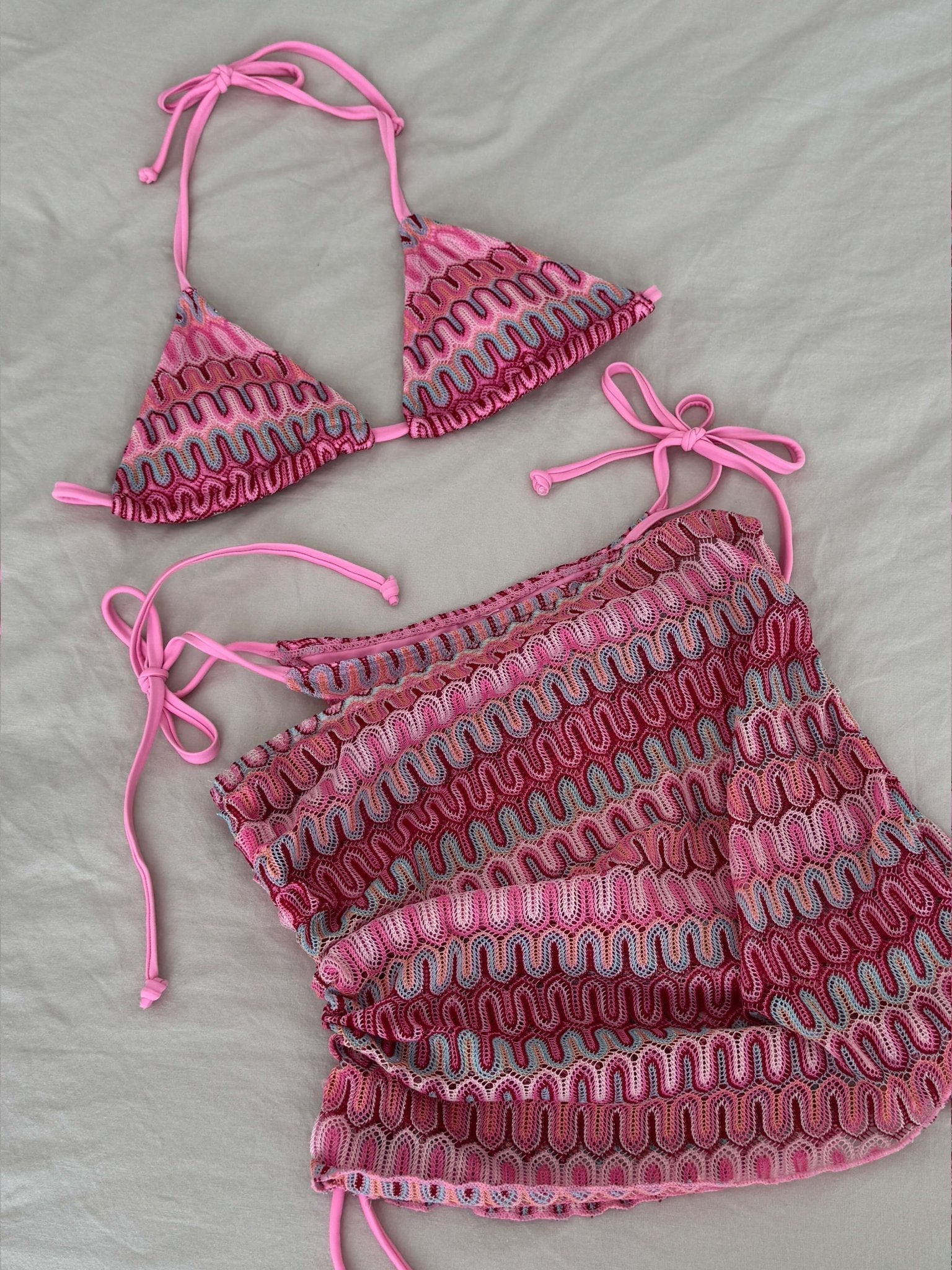 Women’s 3-piece bikini set with triangle top, tie-side bottoms, and mini skirt