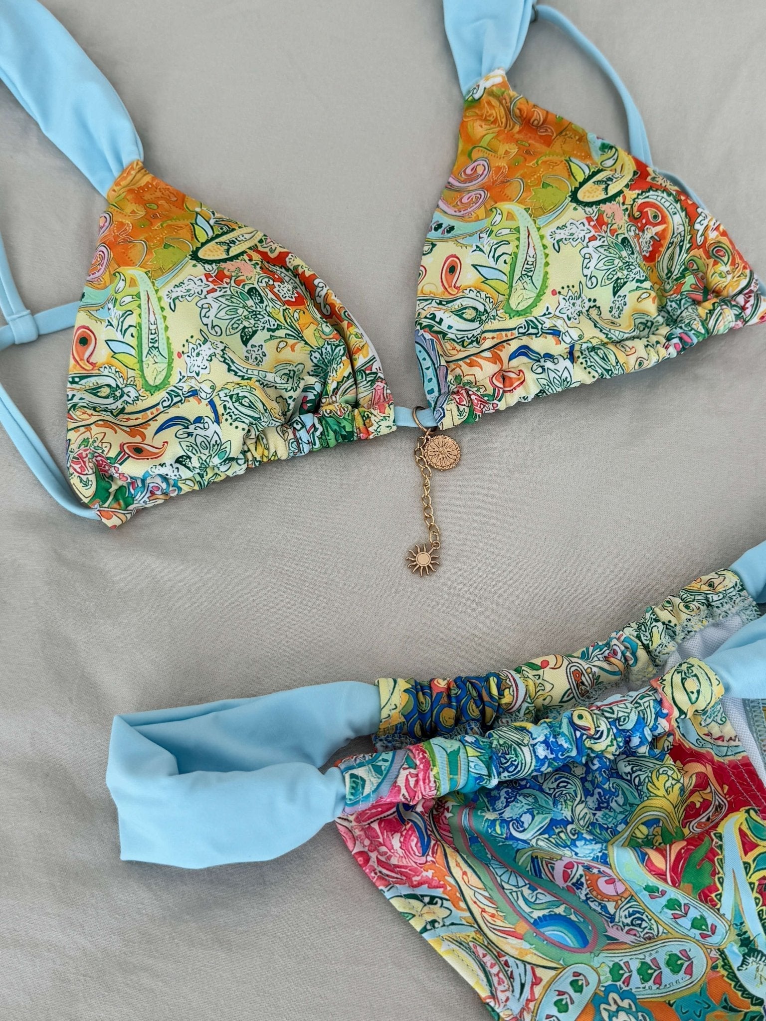 Women’s bikini set with decorative beads – triangle top & printed bottoms, blue/multicolor