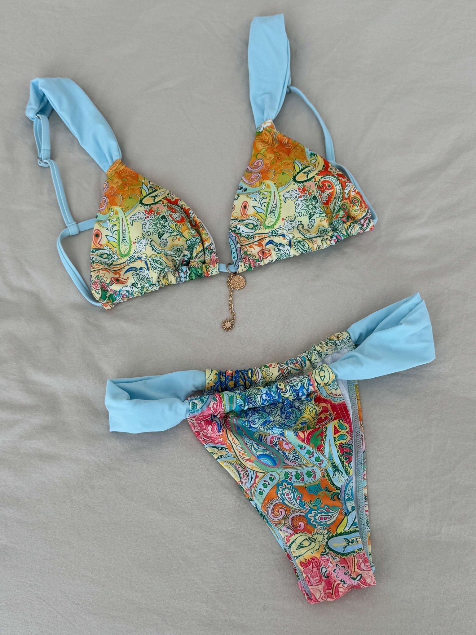 Women’s bikini set with decorative beads – triangle top & printed bottoms, blue/multicolor
