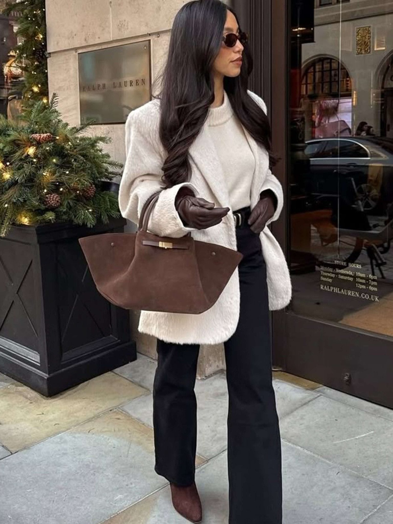 Women’s trapeze-shaped handbag in suede-look material with handles, strap closure, and shoulder strap