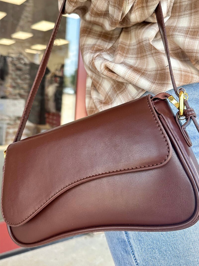 Women's shoulder bag – dark brown leather with wave design