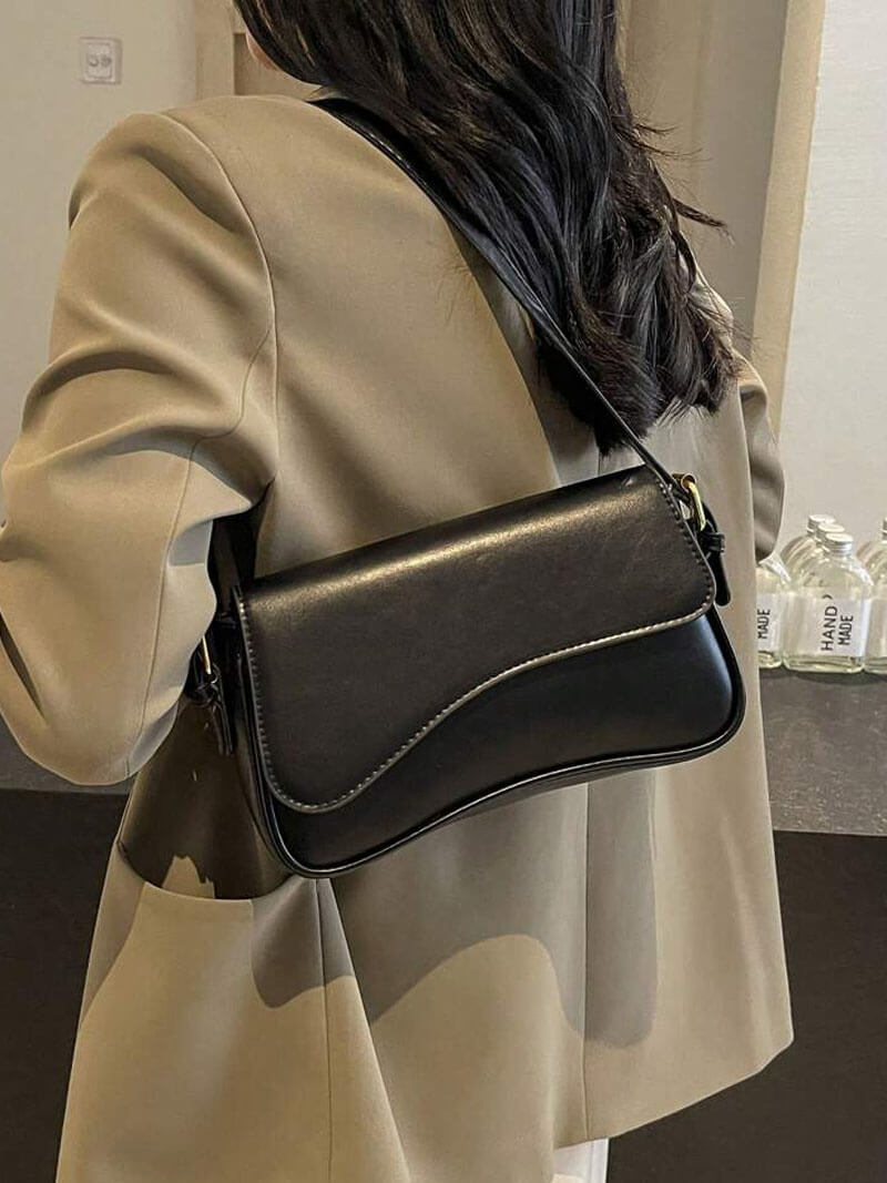 Women's shoulder bag – dark brown leather with wave design